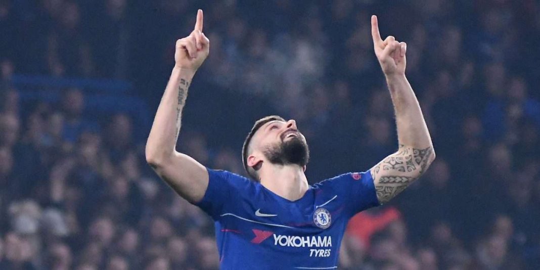 Olivier Giroud, top scorer in the history of the Blues, fingers pointed towards the sky
