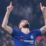 Olivier Giroud, top scorer in the history of the Blues, fingers pointed towards the sky
