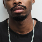 Male earrings, Pastor Max Moïse SAULD responds to our survey